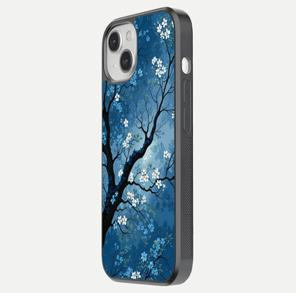 Blue Tree Serenity Glass Case for iPhone 13 Mini side-angle shot showing glossy edge and tree pattern reflection