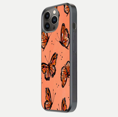 Coral Wing Butterfly Glass Case for iPhone 13 Pro side-angle photo showing reflective finish and smooth edges