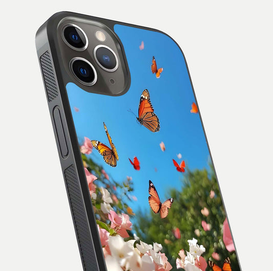 Butterflies in Bloom Sky Glass Case for iPhone 13 Pro close-up shot showing wings, petal reflections, and soft hues