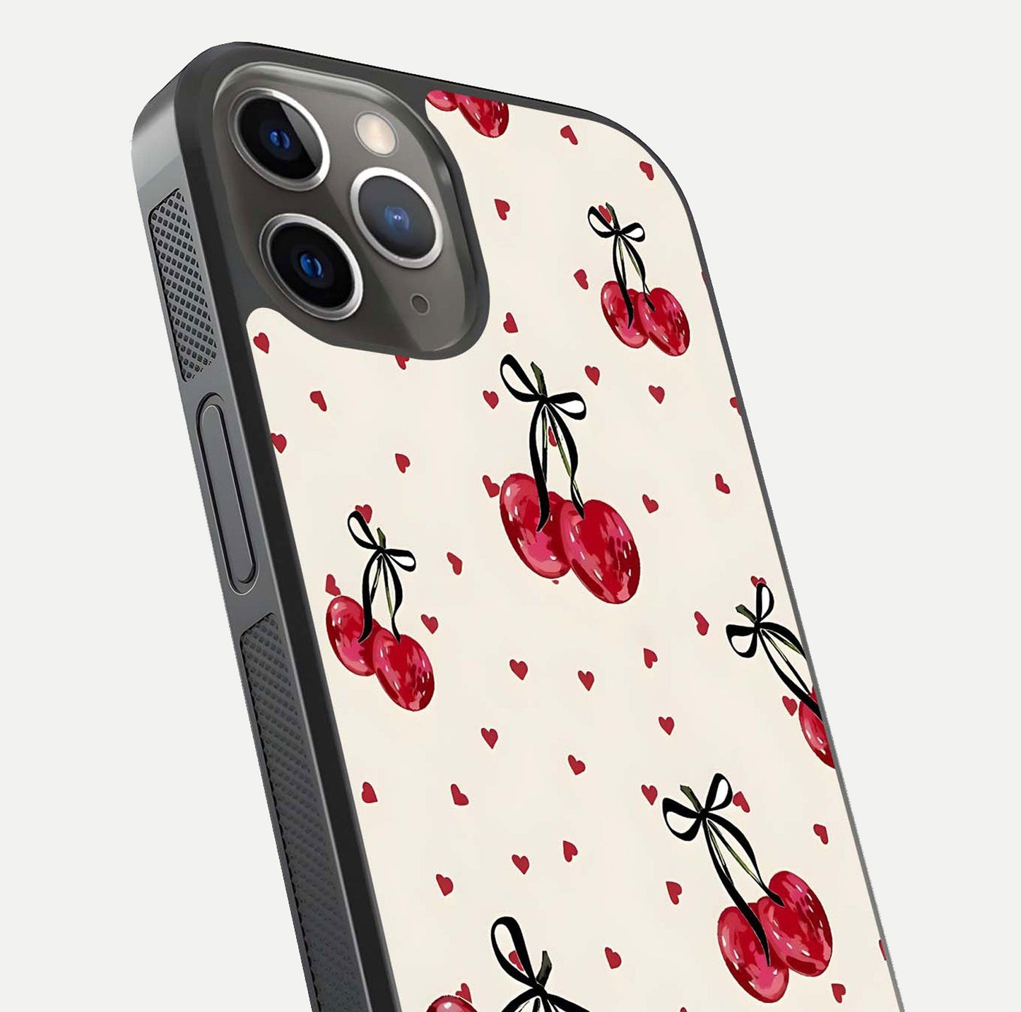 Cherry Heart Bow Glass Case for iPhone 13 Pro close-up highlighting small bows, cherry red tones, and gloss shine