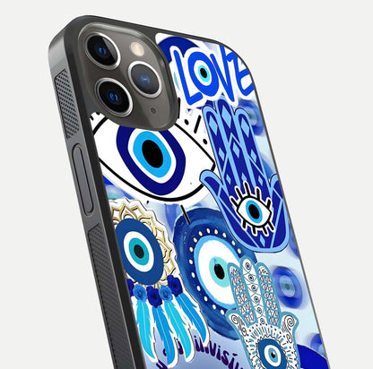 Evil Eyes Dream Glass Case for iPhone 13 Pro close-up highlighting evil-eye charm detail and light reflection on glass