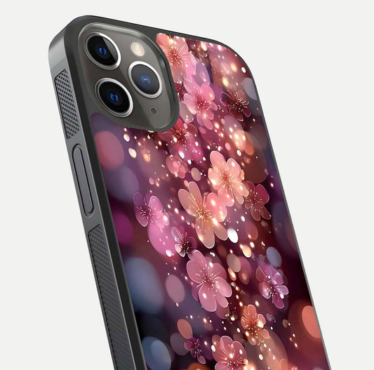 Glowing Petal Bliss Glass Case for iPhone 13 Pro close-up angled shot showing petal glow, color depth, and reflection shine