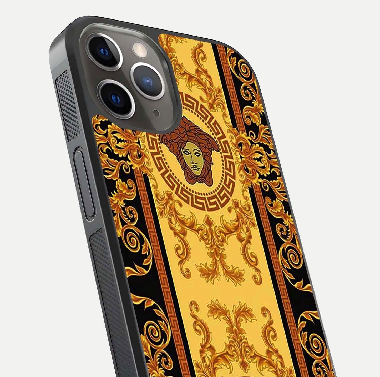 Golden Royal Heritage Glass Case for iPhone 13 Pro close-up angled shot showing intricate design and metallic reflection