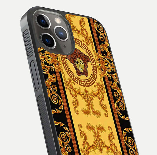 Golden Royal Heritage Glass Case for iPhone 13 Pro close-up angled shot showing intricate design and metallic reflection