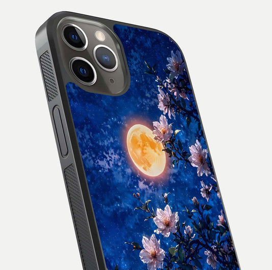 Moonlit Blossoms Night Glass Case for iPhone 13 Pro close-up angled shot showing petal glow and reflection detail