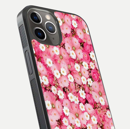 Pink Daisy Bliss Glass Case for iPhone 13 Pro close-up angled shot highlighting daisy detail and reflection glow