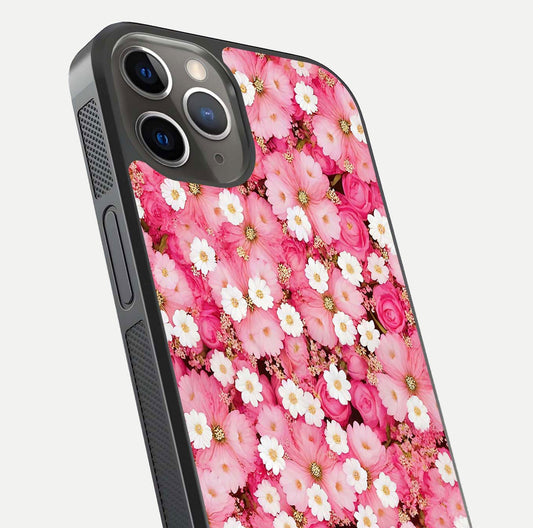 Pink Daisy Bliss Glass Case for iPhone 13 Pro close-up angled shot highlighting daisy detail and reflection glow