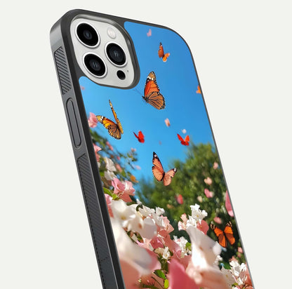 Butterflies in Bloom Sky Glass Case for iPhone 13 Pro Max close-up shot showing wings, petal reflections, and soft hues