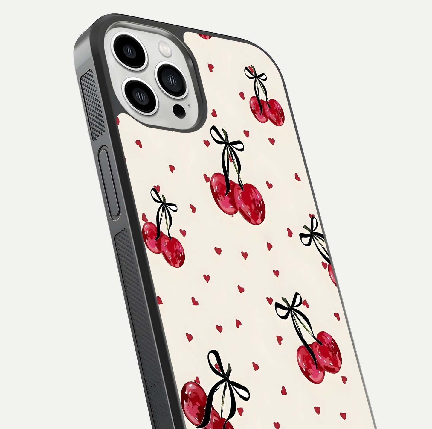 Cherry Heart Bow Glass Case for iPhone 13 Pro Max close-up highlighting small bows, cherry red tones, and gloss shine