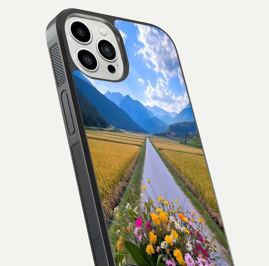 Golden Field Journey Glass Case for iPhone 13 Pro Max close-up angled shot showing sunlight tones and reflection clarity