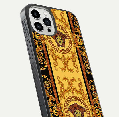 Golden Royal Heritage Glass Case for iPhone 13 Pro Max close-up angled shot showing intricate design and metallic reflection