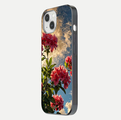 Red Bloom Skies Glass Case for iPhone 14 side-angle image showing reflection, print clarity, and tone blend