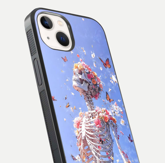 Bloom Beyond Bones Glass Case for iPhone 14 close-up highlighting unique bone-floral fusion art and reflection
