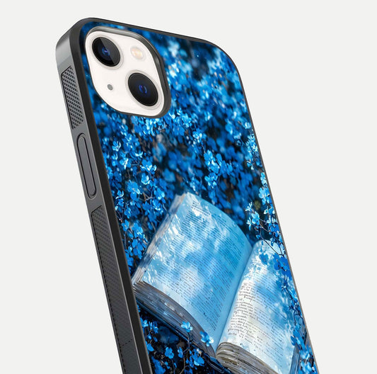 Blue Bloom Tales Glass Case for iPhone 14 close-up angle showing petal texture and blue tone reflection