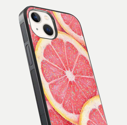 Glitter Grapefruit Glass Case for iPhone 14 close-up angled shot showing fruit texture and glitter reflection