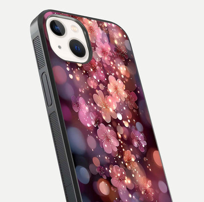 Glowing Petal Bliss Glass Case for iPhone 14 close-up angled shot showing petal glow, color depth, and reflection shine