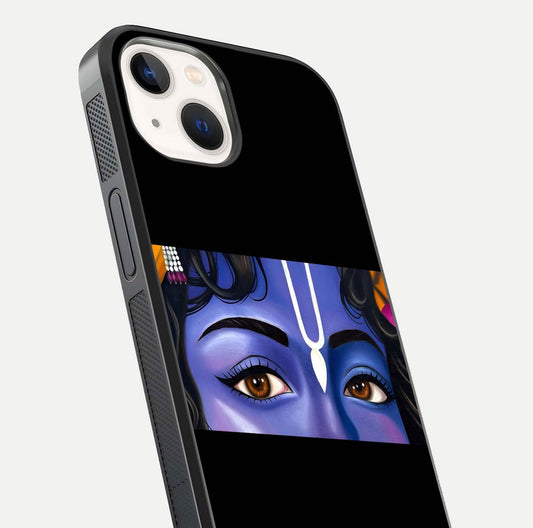 Krishna Eye Glass Case for iPhone 14 close-up angled shot showing intricate artwork and reflection shine