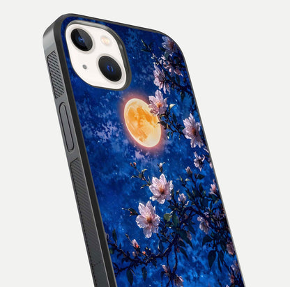 Moonlit Blossoms Night Glass Case for iPhone 14 close-up angled shot showing petal glow and reflection detail