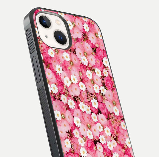 Pink Daisy Bliss Glass Case for iPhone 14 close-up angled shot highlighting daisy detail and reflection glow