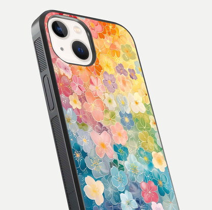 Rainbow Blossom Burst Glass Case for iPhone 14 close-up angled shot showing petal colors and reflection