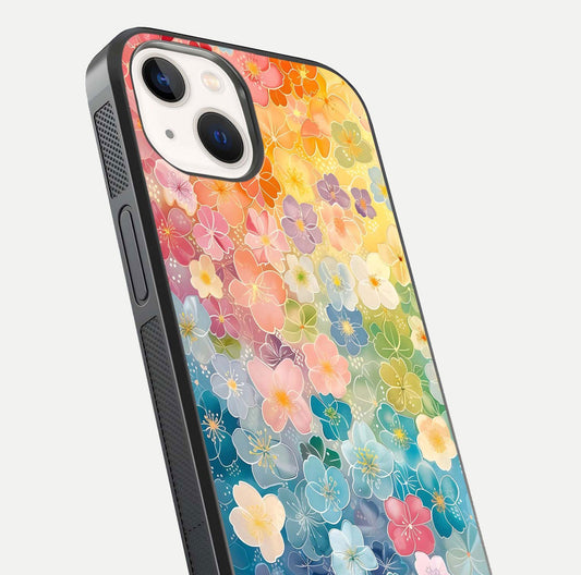 Rainbow Blossom Burst Glass Case for iPhone 14 close-up angled shot showing petal colors and reflection