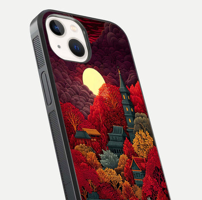 Scarlet Autumn Temple Glass Case for iPhone 14 close-up angled shot highlighting golden leaves and reflection