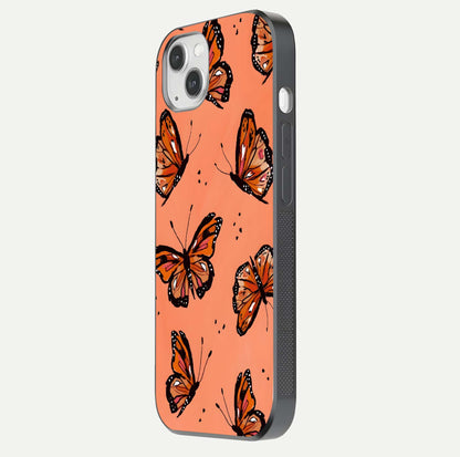 Coral Wing Butterfly Glass Case for iPhone 14 Plus side-angle photo showing reflective finish and smooth edges