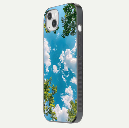Greenery Sky Glass Case for iPhone 14 Plus side-angle image showing reflection glow and nature-themed pattern