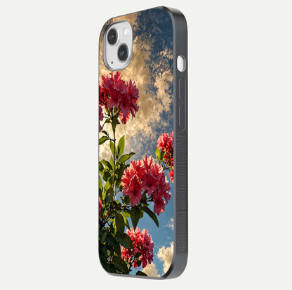 Red Bloom Skies Glass Case for iPhone 14 Plus side-angle image showing reflection, print clarity, and tone blend