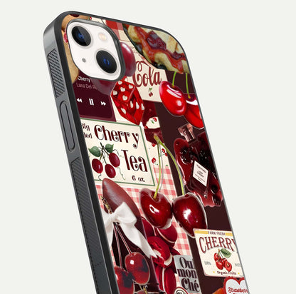 Aesthetic Cherry Tea Glass Case for iPhone 16 Pro close-up angled shot showing detailed cherry artwork, red tones, and gloss reflection