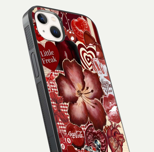 Aesthetic Little Freak Glass Case for iPhone 14 Plus close-up angled shot showing detailed artwork, bold design, and gloss reflection