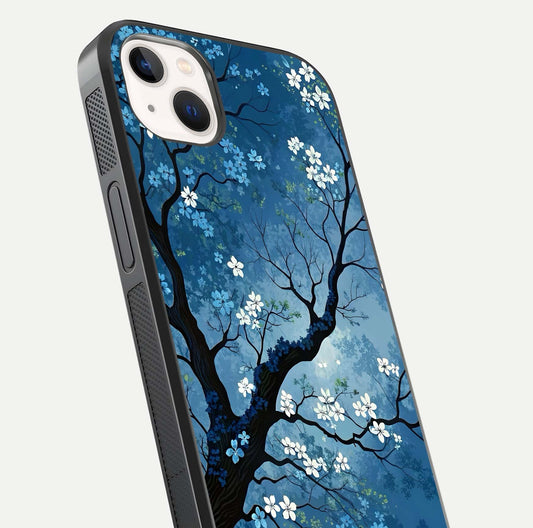 Blue Tree Serenity Glass Case for iPhone 14 Plus close-up view highlighting tree branches and reflection gloss