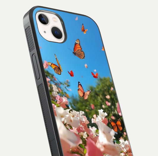 Butterflies in Bloom Sky Glass Case for iPhone 14 Plus close-up shot showing wings, petal reflections, and soft hues