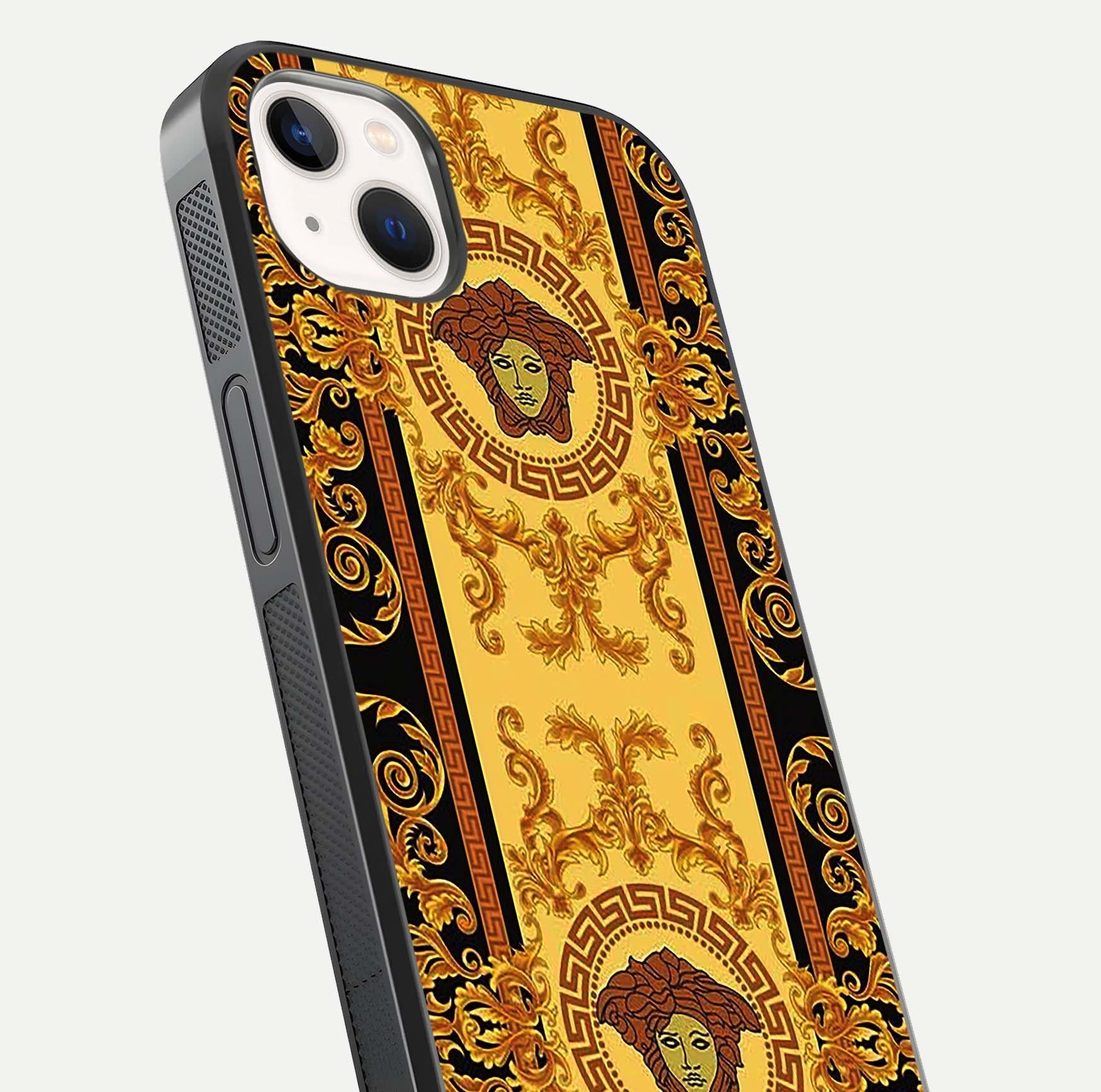 Golden Royal Heritage Glass Case for iPhone 14 Plus close-up angled shot showing intricate design and metallic reflection