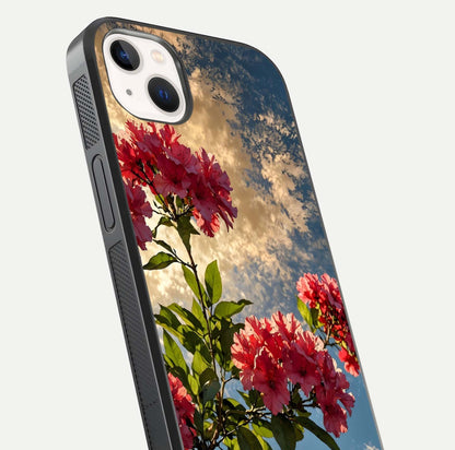 Red Bloom Skies Glass Case for iPhone 14 Plus close-up angled shot highlighting detailed blooms and reflection