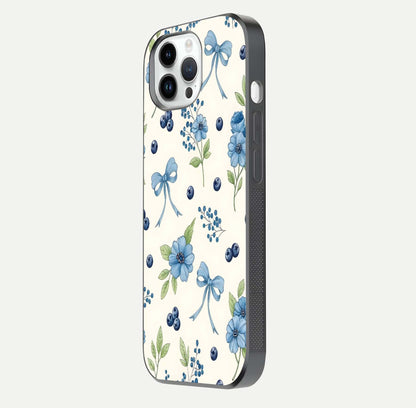 Blue Flower & Bow Glass Case for iPhone 16 Pro side-angle image showing bow-floral mix and HD finish shine