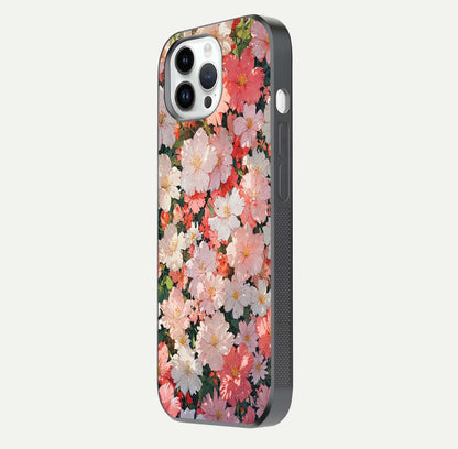 Blush Bloom Field Glass Case for iPhone 14 Pro side-angle image showing petal pattern gloss and smooth edges