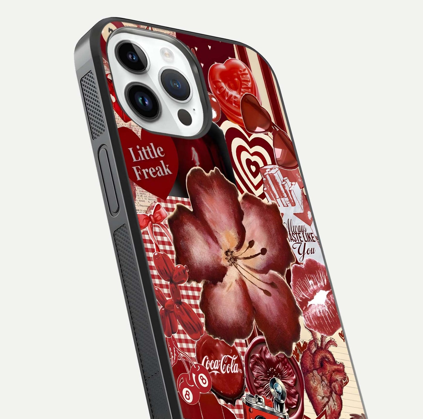 Aesthetic Little Freak Glass Case for iPhone 16 Pro close-up angled shot showing detailed artwork, bold design, and gloss reflection