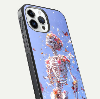 Bloom Beyond Bones Glass Case for iPhone 14 Pro close-up highlighting unique bone-floral fusion art and reflection