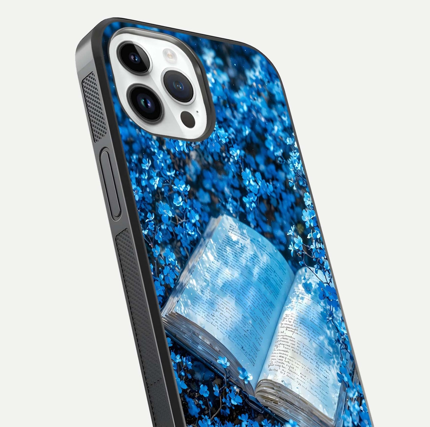 Blue Bloom Tales Glass Case for iPhone 14 Pro close-up angle showing petal texture and blue tone reflection