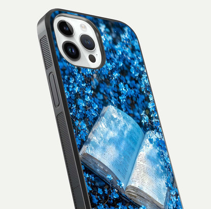 Blue Bloom Tales Glass Case for iPhone 14 Pro close-up angle showing petal texture and blue tone reflection