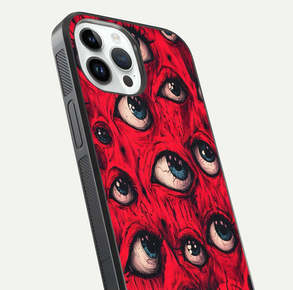 Crimson Watch Eyes Glass Case for iPhone 14 Pro close-up highlighting graphic detail and reflection