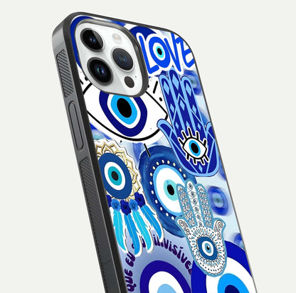 Evil Eyes Dream Glass Case for iPhone 14 Pro close-up highlighting evil-eye charm detail and light reflection on glass