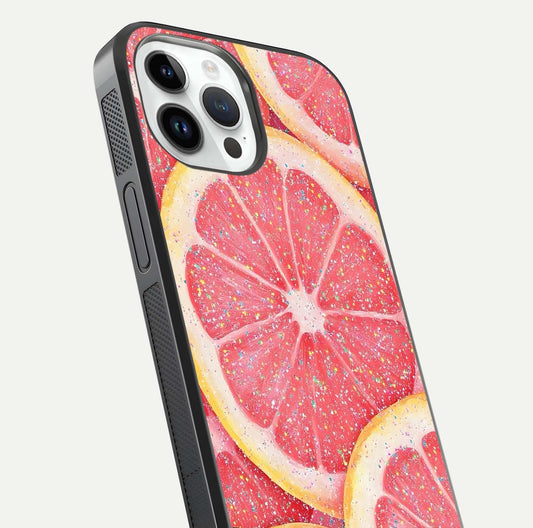 Glitter Grapefruit Glass Case for iPhone 14 Pro close-up angled shot showing fruit texture and glitter reflection