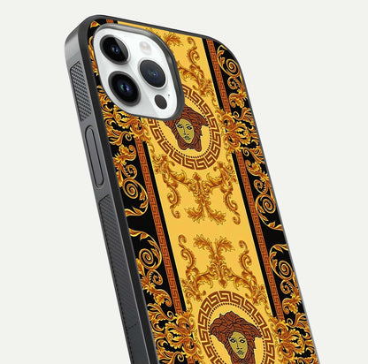 Golden Royal Heritage Glass Case for iPhone 14 Pro close-up angled shot showing intricate design and metallic reflection