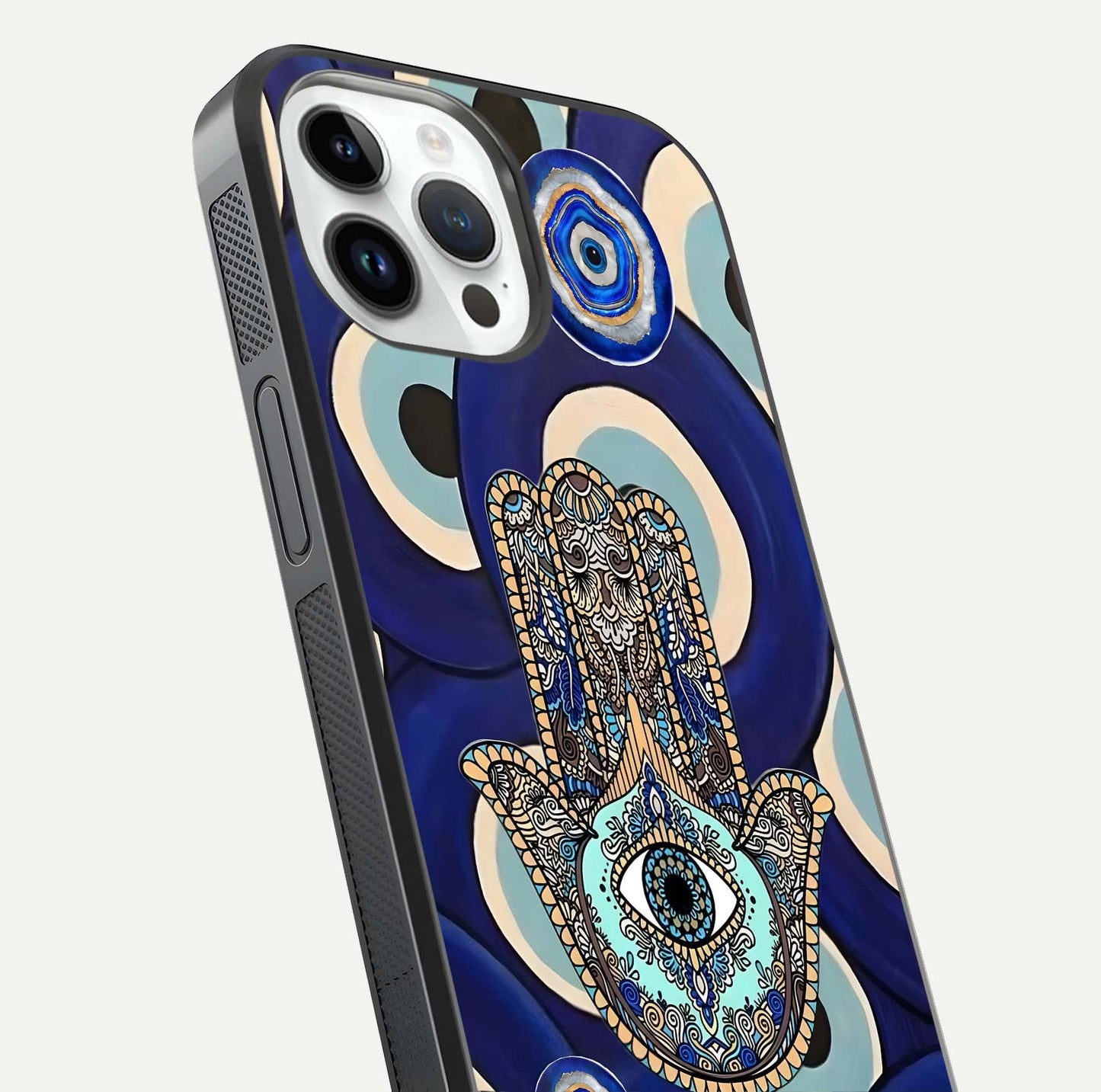 Hamsa Divine Guard Glass Case for iPhone 14 Pro close-up angled shot showing detailed palm motif and reflection glow