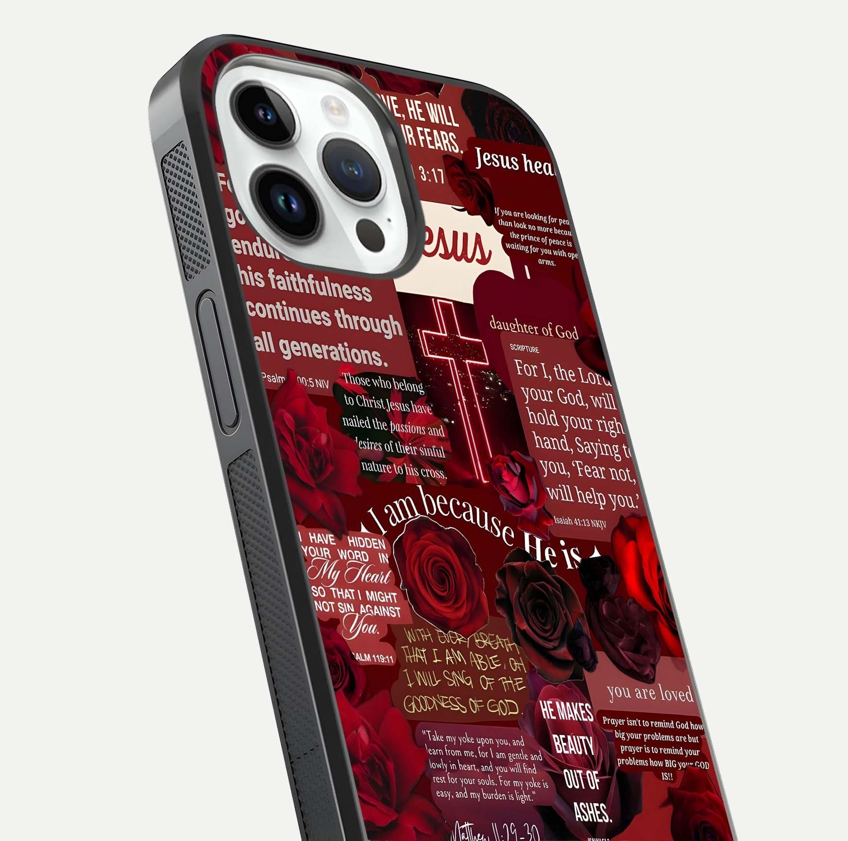 Jesus Love Heals Glass Case for iPhone 14 Pro close-up angled shot showing healing text, cross detailing, and reflection
