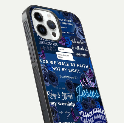 Kingdom Faith Glow Glass Case for iPhone 14 Pro close-up angled shot showing luminous text and divine reflection