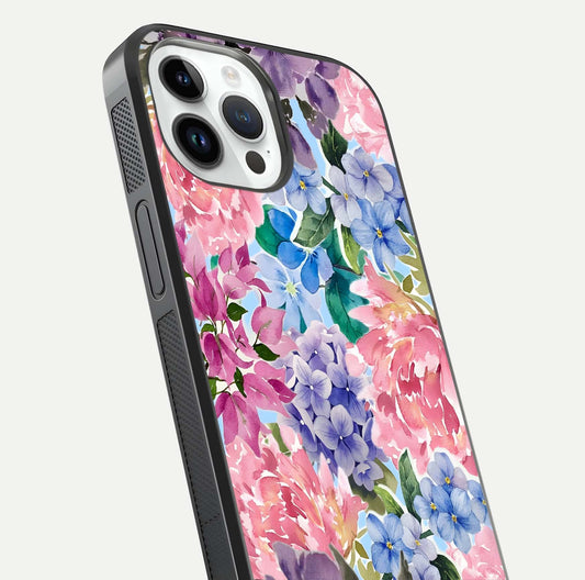 Pastel Floral Mix Glass Case for iPhone 14 Pro close-up angled shot highlighting flower detail and reflection