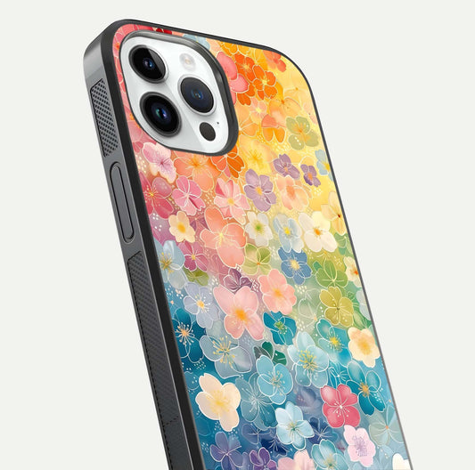 Rainbow Blossom Burst Glass Case for iPhone 14 Pro close-up angled shot showing petal colors and reflection
